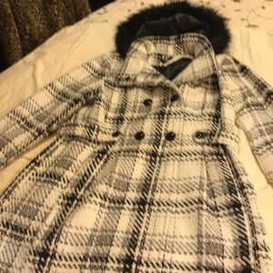 Women’s black and white coat.